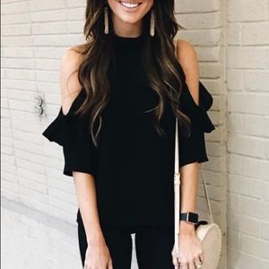 Long sleeved, ruffled, black top